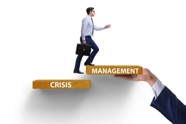 Crisis management concept with climbing businessman — Stock Photo, Image
