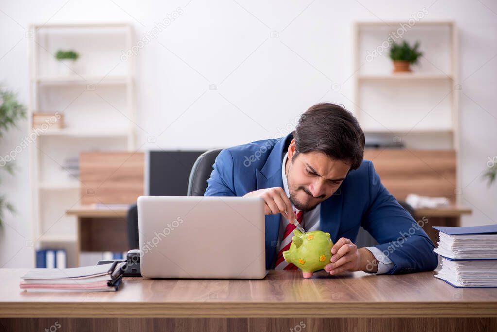 Young male employee in retirement concept at workplace