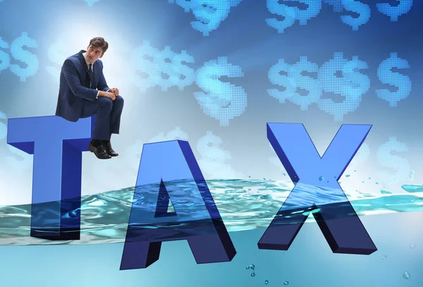 Businessman having problems with paying taxes — Stock Photo, Image