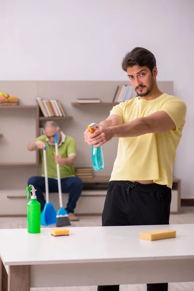 Two male contractors cleaning the house — Stock Photo, Image