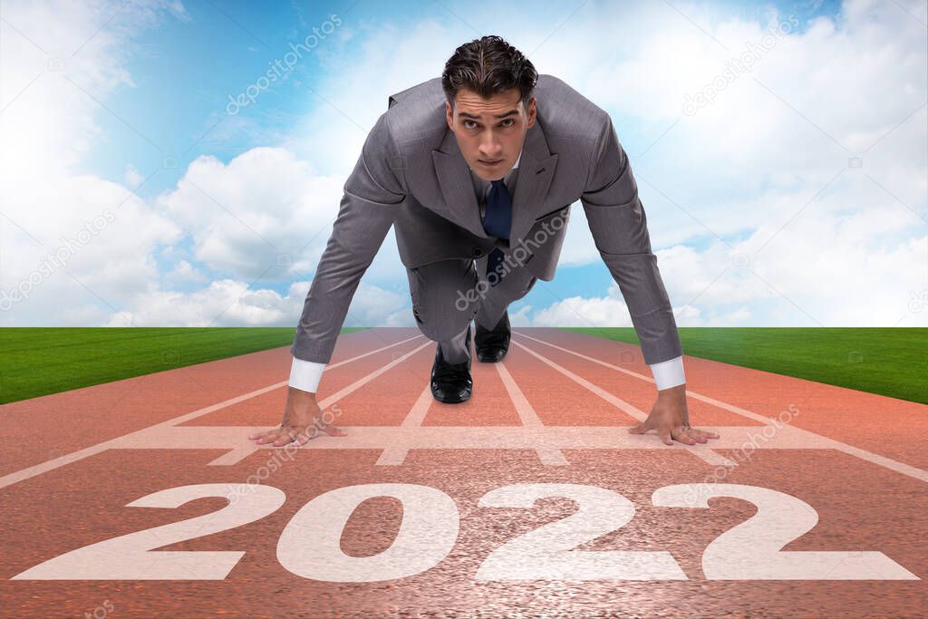 Businessman running to the 2022 year