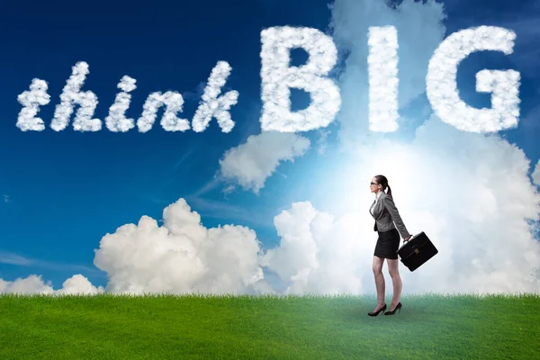 Think big concept with businesswoman — Stock Photo, Image