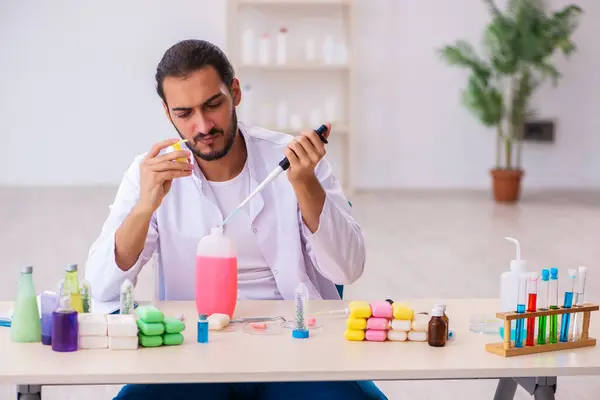 Young male chemist testing soap in the lab — Stock Photo, Image