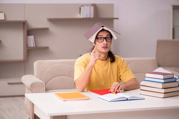 Young male student preparing for exams at home — Stock Photo, Image