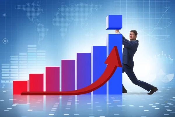 A gazdasági növekedést támogató üzletember a grafikonon — Stock Fotó