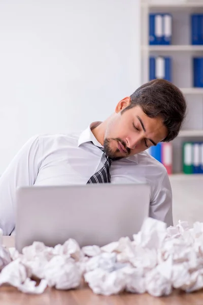 Young male employee in brainstorming concept — Stock Photo, Image