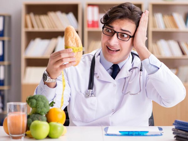 Doctor in dieting concept with fruits and vegetables