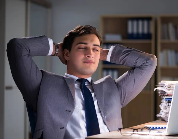 Businessman staying in the office for long hours — Stock Photo, Image