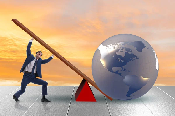 Businessman lifting the earth in challenge concept — Stock Photo, Image