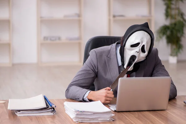 Devil businessman employee sitting at workplace — Stock Photo, Image