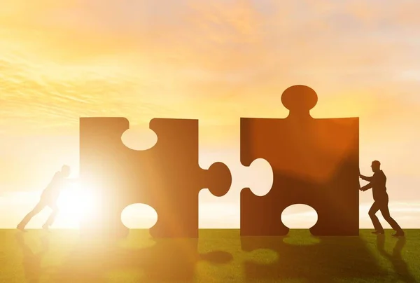 Business metaphor of teamwork with jigsaw puzzle — Stock Photo, Image