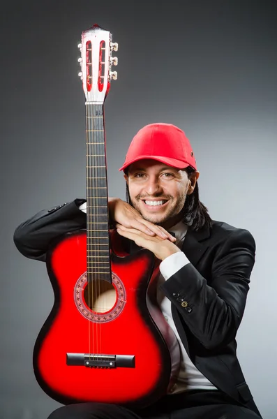 Funny guitar player in studio — Stock Photo, Image