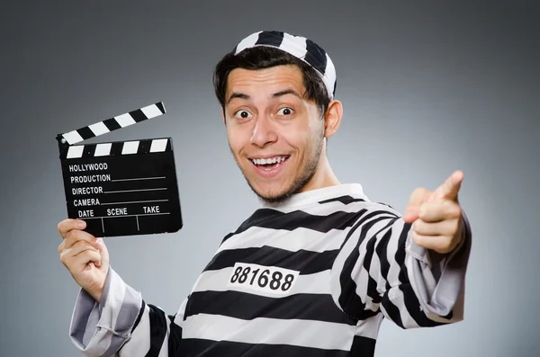 Inmate with movie clapper board — Stock Photo, Image