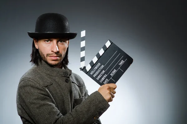 Man med film clapperboard och hatt — Stockfoto