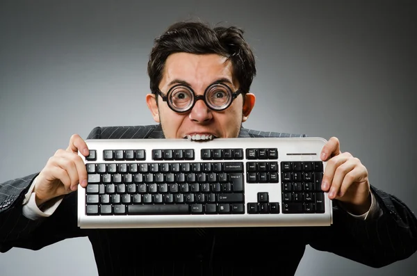 Comouter geek with computer keyboard Royalty Free Stock Photos