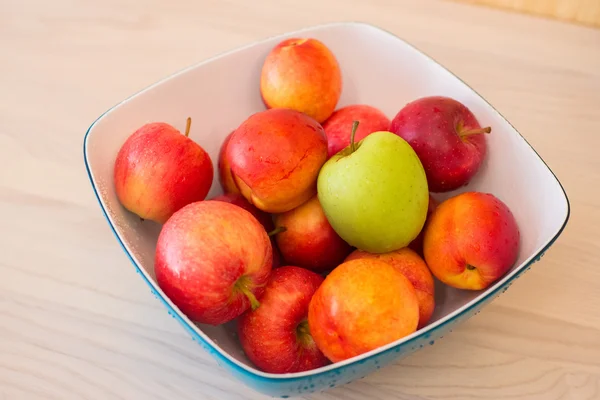 Fruits in the bown on table — Stock Photo, Image