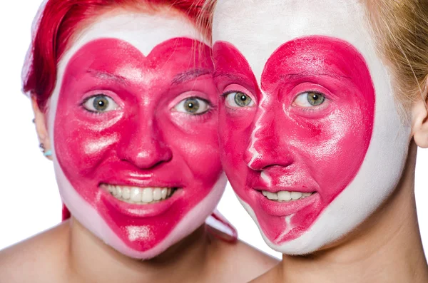 Donna con cuore viso pittura isolato su bianco — Foto Stock