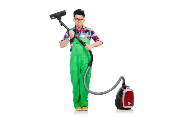 Funny man in green coveralls vacuum cleaning — Stock Photo, Image