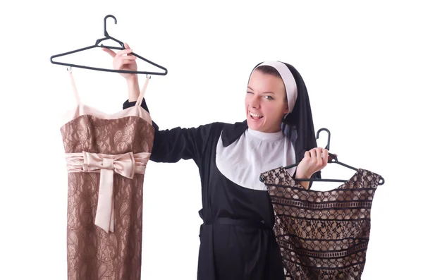 Nonne wählt Kleidung auf dem Kleiderbügel isoliert auf weiß — Stockfoto