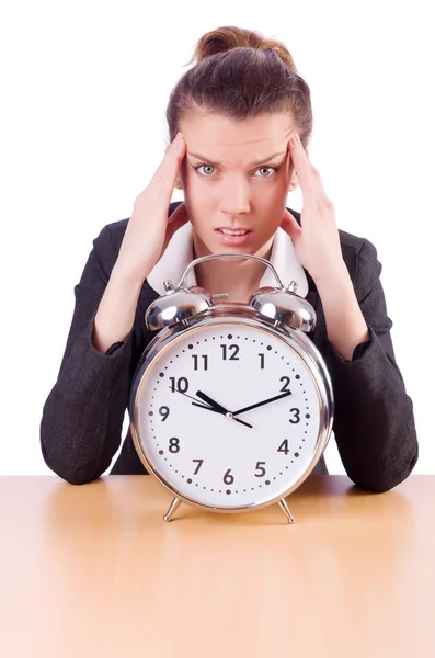 Businesswoman with clock missing her deadlines — Stock Photo, Image