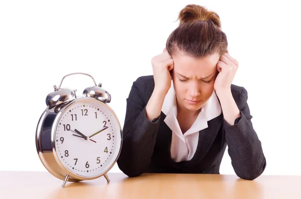 Businesswoman with clock missing her deadlines — Stock Photo, Image