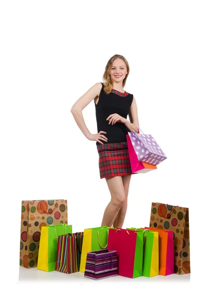 Jonge vrouw na het winkelen geïsoleerd op de witte — Stockfoto