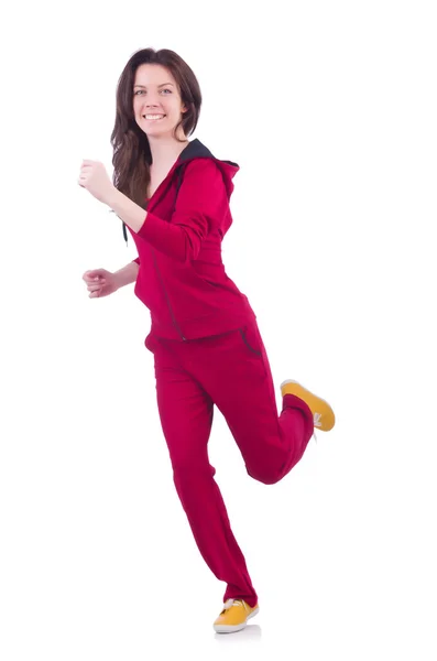 Mulher em traje vermelho fazendo exercícios em branco — Fotografia de Stock