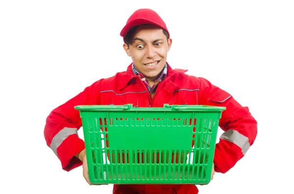 Человек в красном комбинезоне с тележкой из супермаркета — стоковое фото