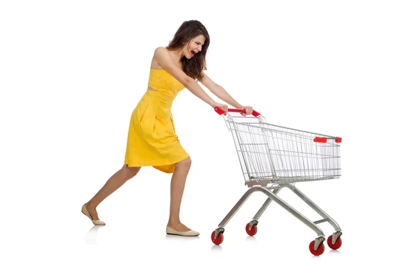 Woman with shopping trolley isolated on white — Stock Photo, Image