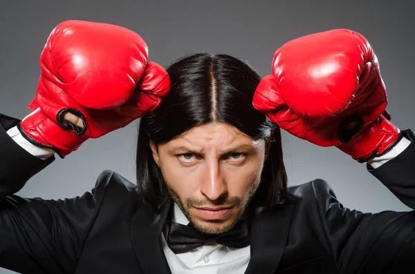 Man businessman with boxing gloves — Stock Photo, Image