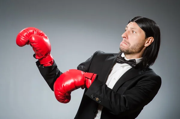 Man businessman with boxing gloves — Stock Photo, Image