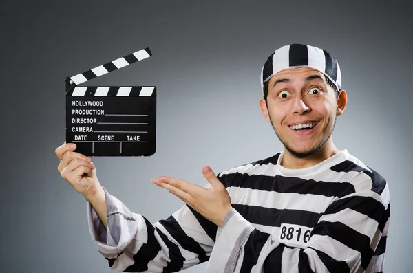 Inmate with movie clapper board — Stock Photo, Image