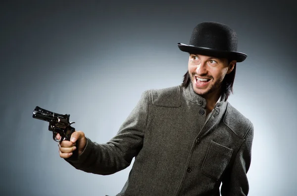 Man with gun and vintage hat — Stock Photo, Image