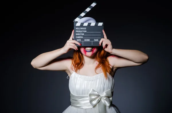 Satan halloween concept met film clapper board — Stockfoto