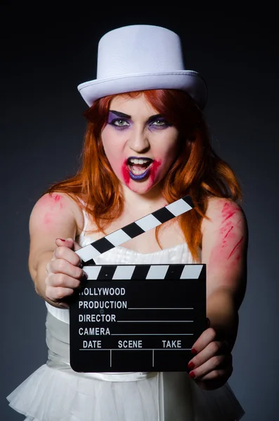 Satan halloween concept with movie clapper board — Stock Photo, Image