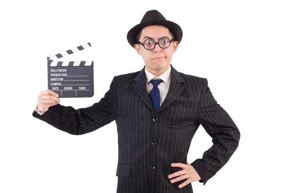 Hombre divertido en traje elegante con tablero de película aislado en blanco —  Fotos de Stock