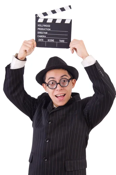 Hombre divertido en traje elegante con tablero de película aislado en blanco — Foto de Stock