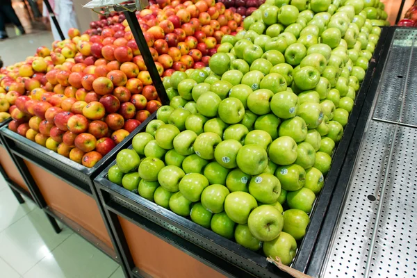 Apple stall in big supermarket — Stock Photo, Image