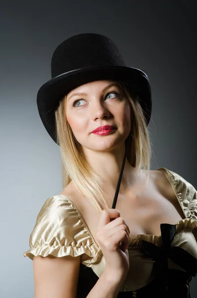 Woman magician with magic wand and hat — Stock Photo, Image