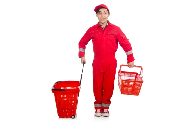 Uomo in tuta rossa con carrello del supermercato — Foto Stock