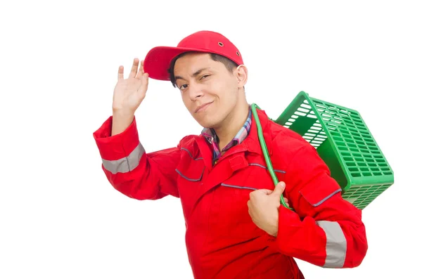 Человек в красном комбинезоне с тележкой из супермаркета — стоковое фото