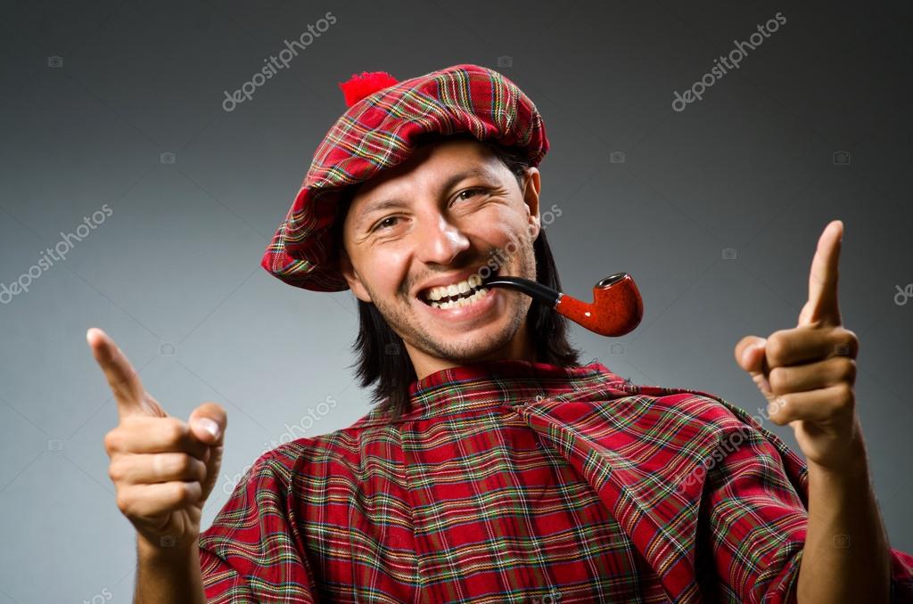 Funny scotsman with smoking pipe — Stock Photo © Elnur_ 53001025