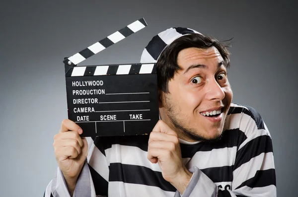 Inmate with movie clapper board — Stock Photo, Image