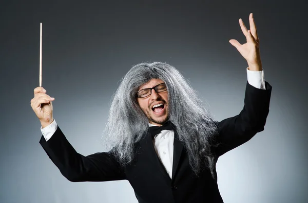 Funny conductor with long grey hair — Stock Photo, Image