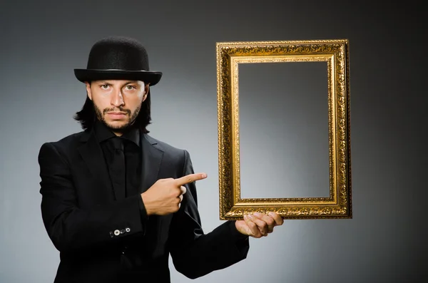 Man in topper hat and picture frame — Stock Photo, Image