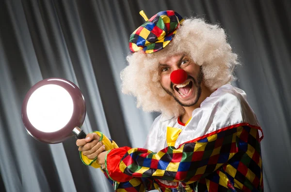 Angry clown with frying pan — Stock Photo, Image