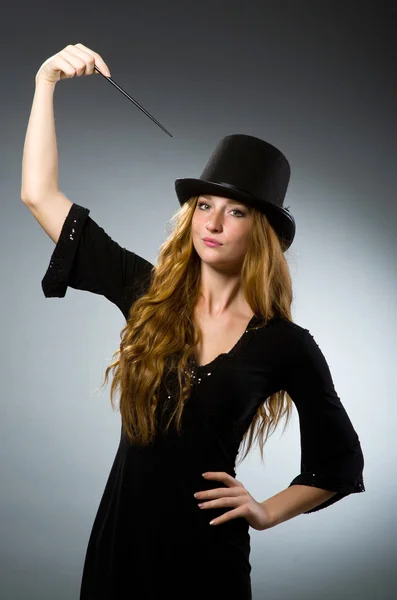 Woman magician doing her tricks with wand — Stock Photo, Image