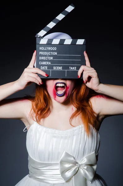 Satan halloween concept with movie clapper board — Stock Photo, Image