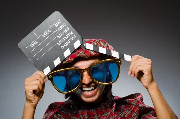 Divertido escocés con película clapboard —  Fotos de Stock