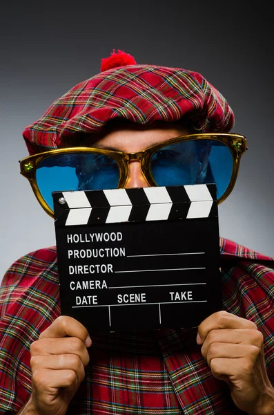 Divertente scozzese con clapboard di film — Foto Stock